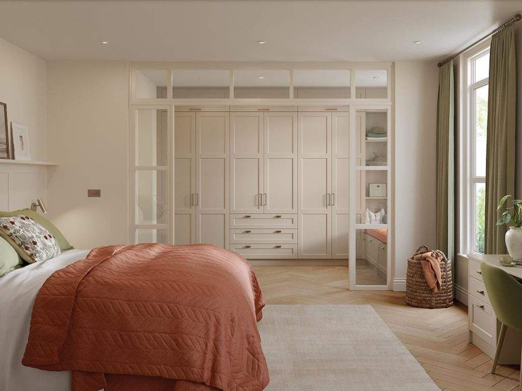 Fitted Bespoke White Furniture In A Large Stylish Bedroom.