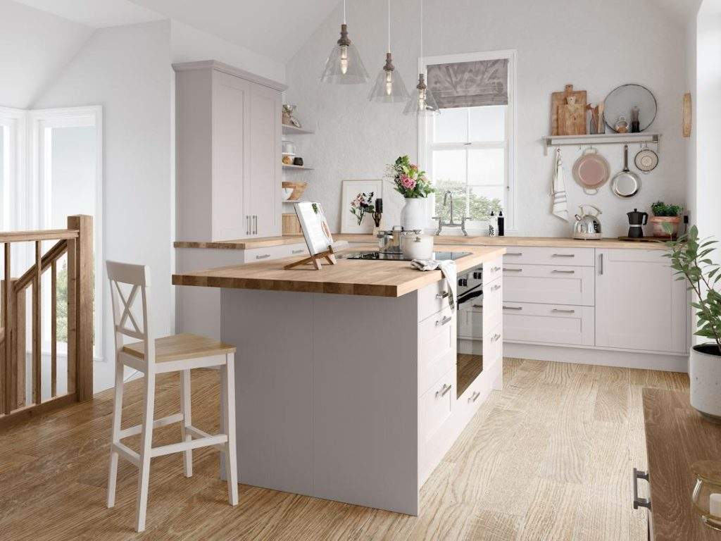 light grey kitchen units with wooden worktop