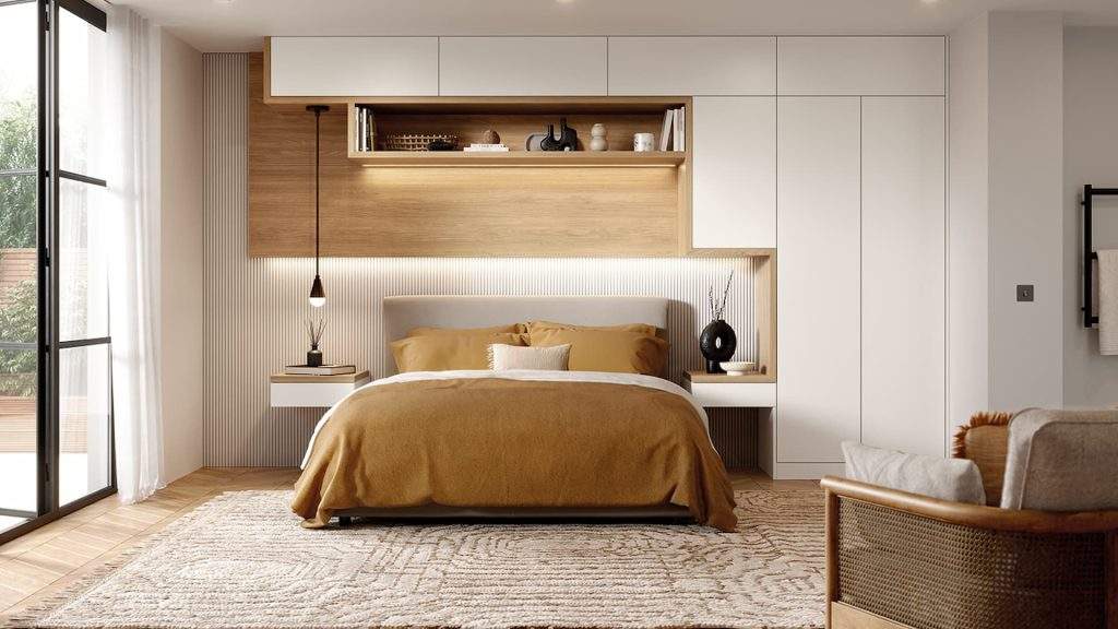 Double Bed With Mustard Sheets In newly Renovated Bedroom With Custom Wardrobe And Storage Solutions.